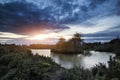 Beautiful Autumn sunset over lake landscape in forest Royalty Free Stock Photo