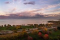 Beautiful autumn sunset over Lake Michigan and Lake Shore Drive in Chicago with pink and blue clouds and red, yellow and green Royalty Free Stock Photo