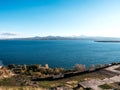 Beautiful autumn view with blowing wind at Lake Sevan, landscape on the hill near Sevanavank Monastery, blue water with mountains Royalty Free Stock Photo