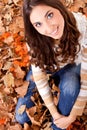 Beautiful autumn woman in leaves Royalty Free Stock Photo
