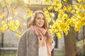 Beautiful autumn woman with maple leaf. Simling Romantic girl in fall park