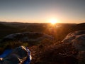 Beautiful awakening in rocks. Sleeping in nature in sleeping bag. View from rocky peak