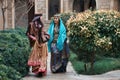 Beautiful azeri women in traditional Azerbaijani dress running by the wooden door Royalty Free Stock Photo