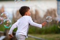 Beautiful baby boy with child soap bubbles posing photographer for cool photo Royalty Free Stock Photo