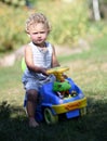 Beautiful baby boy with child toy car posing photographer Royalty Free Stock Photo