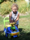 Beautiful baby boy with child toy car posing photographer Royalty Free Stock Photo