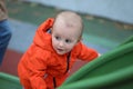 Beautiful Baby Boy Climbing Up A Slide Royalty Free Stock Photo