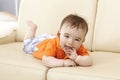 Beautiful baby boy lying on sofa Royalty Free Stock Photo