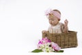 Beautiful baby girl in a basket