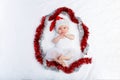 Beautiful baby girl in christmas hat lying Royalty Free Stock Photo