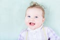 Beautiful baby girl on a green blanket Royalty Free Stock Photo