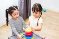 Beautiful baby girl kindergarten playing loop toy education Royalty Free Stock Photo