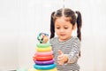 Beautiful baby girl kindergarten playing loop toy education Royalty Free Stock Photo