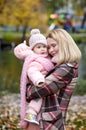 Beautiful baby girl with mother outdoors. Family outdoor Royalty Free Stock Photo