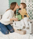 Beautiful baby girl near a Christmas tree with gifts with Royalty Free Stock Photo