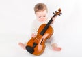 Beautiful baby girl playing with a violin Royalty Free Stock Photo