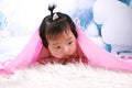 Beautiful baby girl under blanket Royalty Free Stock Photo