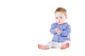 Beautiful baby girl wearing a purple sweater clapping her hands Royalty Free Stock Photo