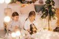 Beautiful baby girls near a Christmas tree with gifts Royalty Free Stock Photo