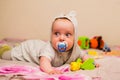 Beautiful baby with a nipple Royalty Free Stock Photo