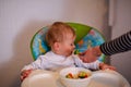 Beautiful baby refuses to eat vegetable Royalty Free Stock Photo