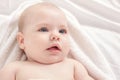 Beautiful baby relaxing in bed after bath Royalty Free Stock Photo