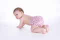 Beautiful baby sitting on the floor isolated Royalty Free Stock Photo