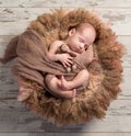 Beautiful baby sleeping sweet on fluffy round cot