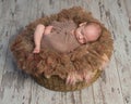 Beautiful baby sleeping sweet on fluffy round cot