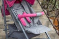 Gray stroller for a walk,beautiful baby stroller, empty stroller standing in front of the stairs to the house