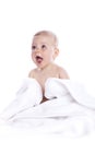 Beautiful baby under a white towel Royalty Free Stock Photo