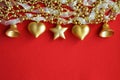 Beautiful background for decoration for Christmas and New Year. Golden toys for decoration for winter holidays. A heart, a star, a Royalty Free Stock Photo