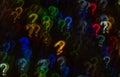 Beautiful background with different colored question mark, abstract background, question mark shapes on black background Royalty Free Stock Photo