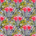 Beautiful background of flowers field of daisies and bells and two hearts made of caramel and marzipan on Valentine`s day. Copy Royalty Free Stock Photo