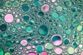 Beautiful background of green and pink water drops.