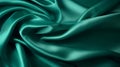 Beautiful background luxury cloth with drapery and wavy folds of green color creased smooth silk satin material texture Royalty Free Stock Photo