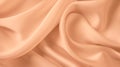 Beautiful background luxury cloth with drapery and wavy folds of peach fuzz color creased smooth silk satin material Royalty Free Stock Photo