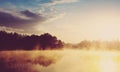 Beautiful background of nature. wonderful misty landscape. amazing foggy morning, colorful sky reflected in the water of tranquil Royalty Free Stock Photo