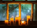 beautiful background with raindrops on the window and burning candles Royalty Free Stock Photo