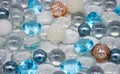 Beautiful background of transparent, light blue glass beads, crystals and white pearls. Copy space Royalty Free Stock Photo