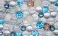 Beautiful background of transparent, light blue glass beads, crystals and white pearls. Copy space Royalty Free Stock Photo