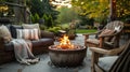 Beautiful backyard firepit at dusk with comfortable chairs Royalty Free Stock Photo