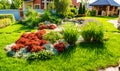 Beautiful backyard landscape design. View of colorful trees and decorative trimmed bushes rocks Royalty Free Stock Photo