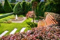 Beautiful backyard landscape design. View of colorful trees and decorative trimmed bushes rocks Royalty Free Stock Photo