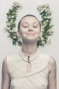 Beautiful bald-headed girl over floral background Royalty Free Stock Photo