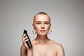 Beautiful bald woman with hairclipper. beauty portrait of short haircut Girl Royalty Free Stock Photo