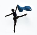 Beautiful ballerina with blue veil dancing on white background. Dark silhouette of dancer Royalty Free Stock Photo