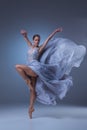 The beautiful ballerina dancing in blue long dress Royalty Free Stock Photo