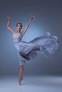 The beautiful ballerina dancing in blue long dress Royalty Free Stock Photo
