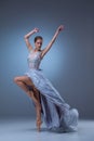 The beautiful ballerina dancing in blue long dress Royalty Free Stock Photo